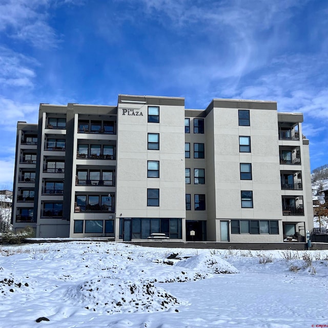 view of snow covered property