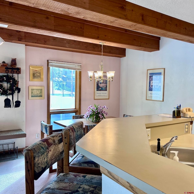 dining room with beam ceiling and a chandelier