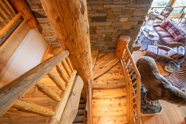 stairs featuring hardwood / wood-style flooring