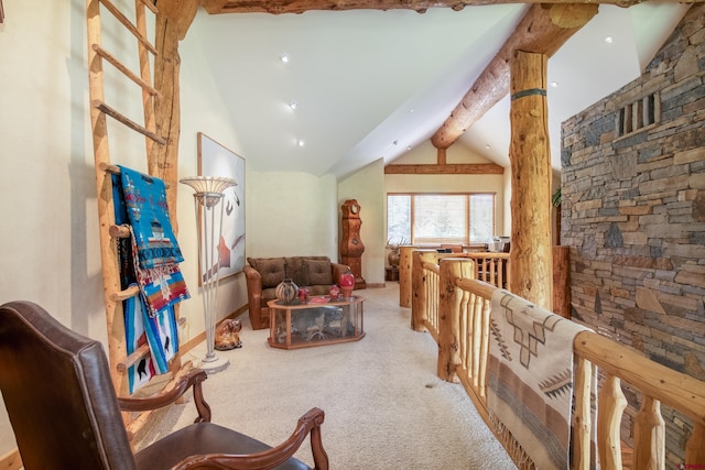 sitting room with lofted ceiling with beams and light colored carpet