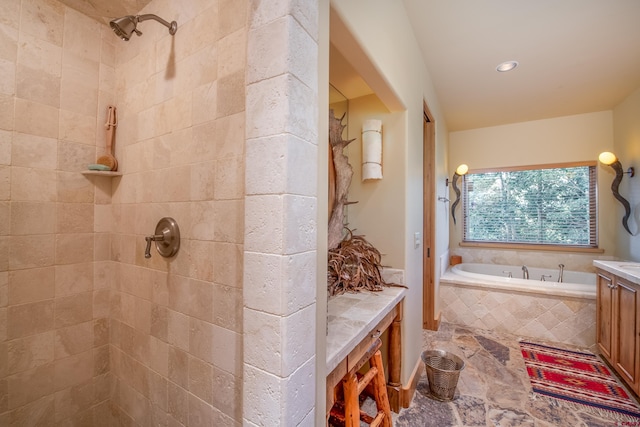 bathroom featuring vanity and shower with separate bathtub