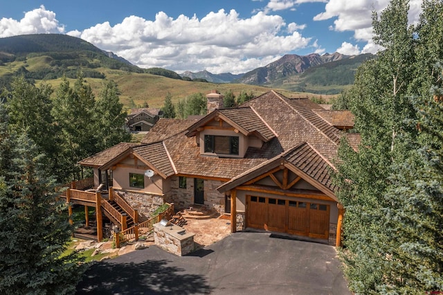 view of front of house featuring a garage and a mountain view