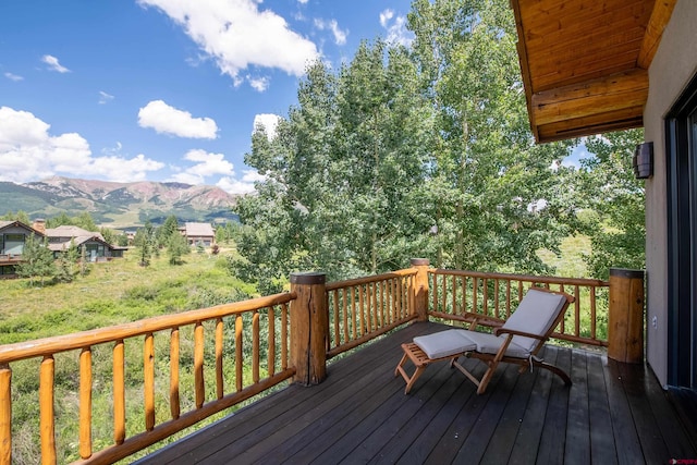 wooden terrace featuring a mountain view