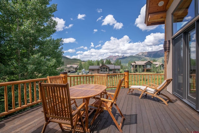 wooden deck with a mountain view