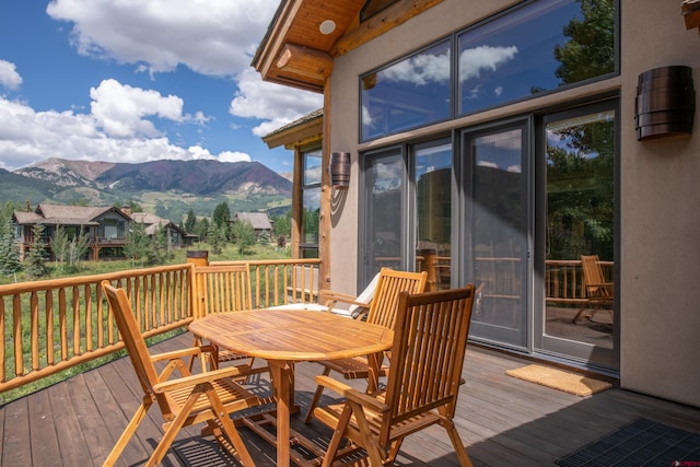 wooden deck featuring a mountain view