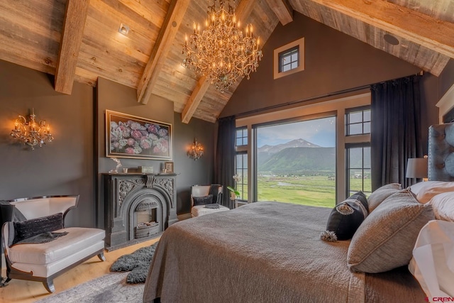 bedroom featuring access to outside, wood ceiling, hardwood / wood-style floors, beamed ceiling, and a mountain view