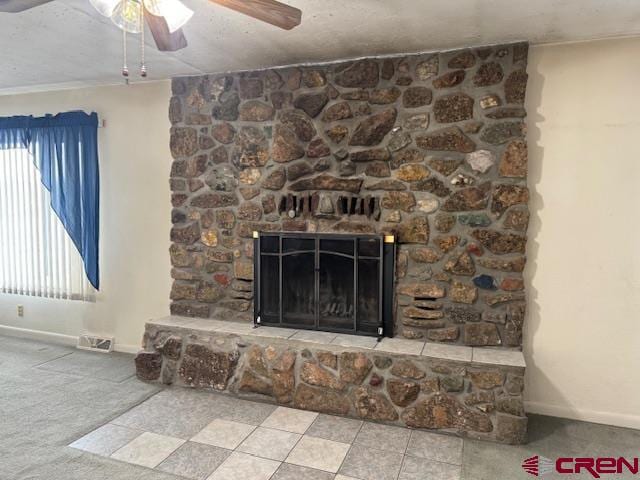 interior details with carpet flooring, ceiling fan, and a fireplace