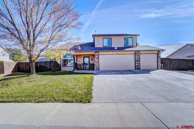 front of property with a front lawn and a garage