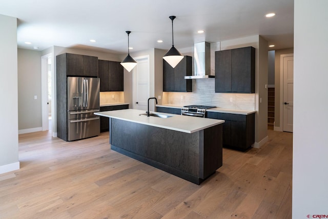 538 Hermosa Meadows Rd, Durango, CO 81301 - kitchen with stainless steel appliances, wall chimney exhaust hood, a sink, backsplash, and recessed lighting