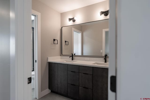 538 Hermosa Meadows Rd, Durango, CO 81301 - full bath featuring double vanity, toilet, and baseboards