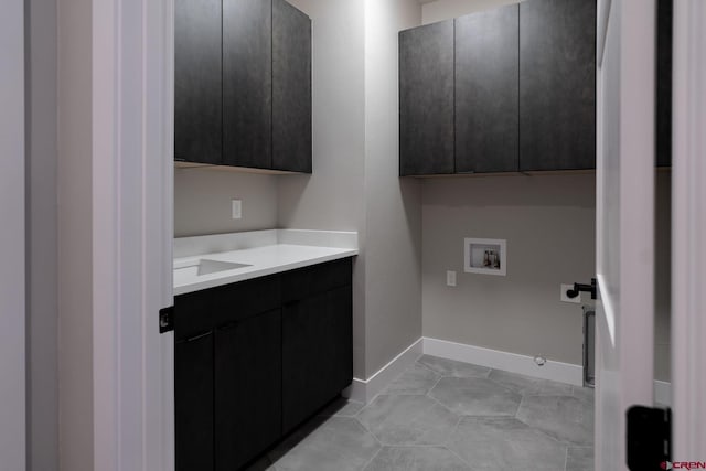 538 Hermosa Meadows Rd, Durango, CO 81301 - laundry room featuring cabinet space, washer hookup, electric dryer hookup, baseboards, and hookup for a gas dryer