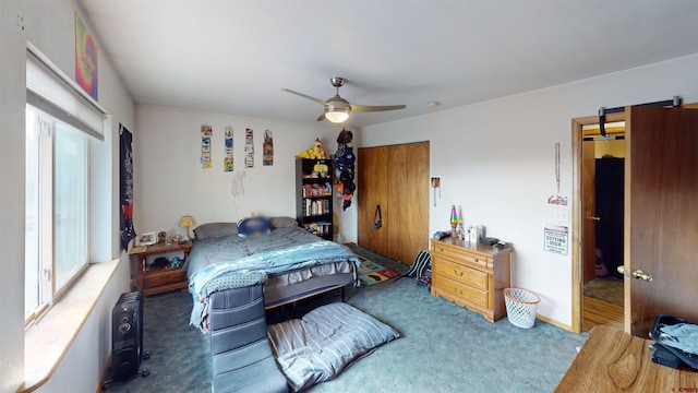 carpeted bedroom featuring ceiling fan