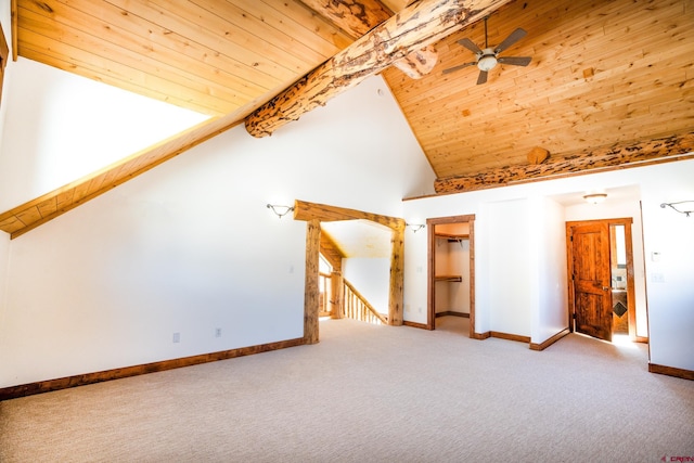 additional living space with wood ceiling, high vaulted ceiling, carpet, and ceiling fan