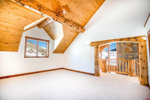 bonus room featuring carpet flooring, wooden ceiling, and vaulted ceiling with beams