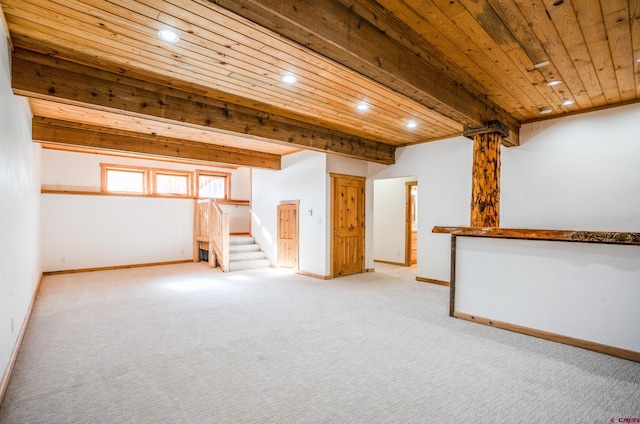 interior space featuring wooden ceiling and light colored carpet