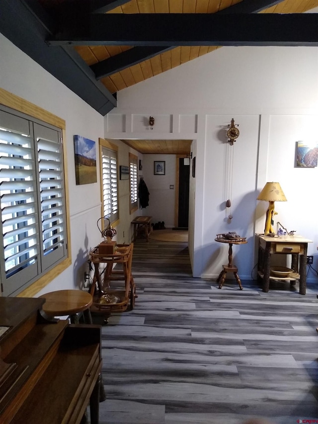 interior space featuring wood ceiling, hardwood / wood-style floors, and vaulted ceiling with beams