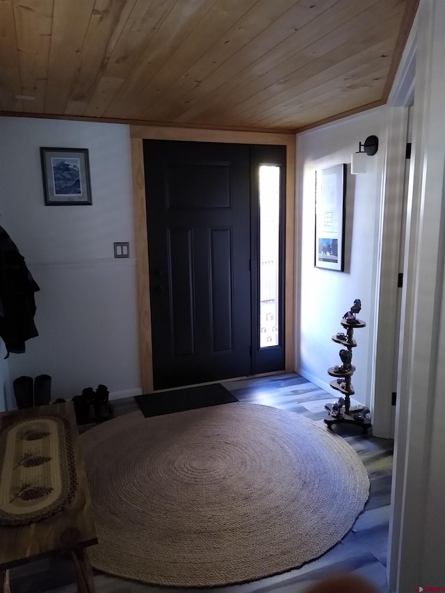 entryway featuring hardwood / wood-style flooring and wood ceiling