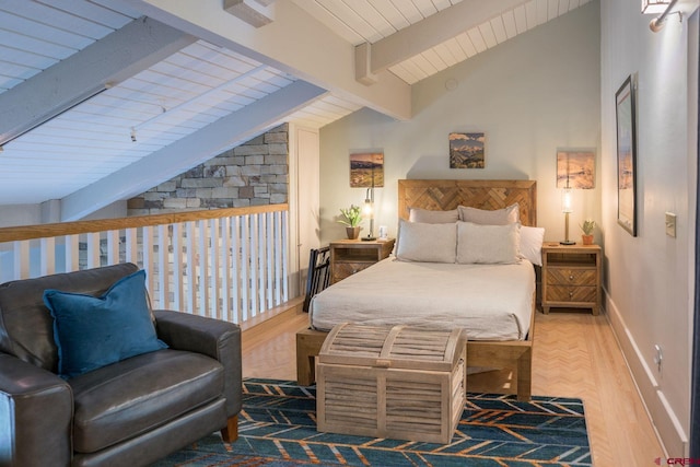 bedroom with vaulted ceiling with beams and light hardwood / wood-style flooring