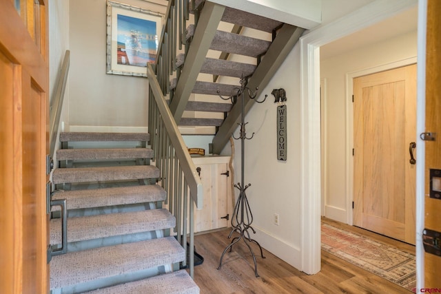 staircase featuring hardwood / wood-style flooring