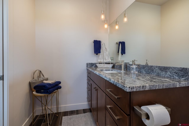 bathroom with hardwood / wood-style flooring and vanity