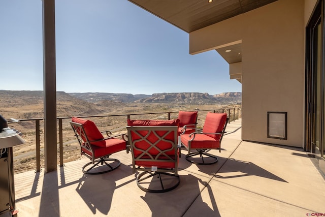 view of patio / terrace with a mountain view