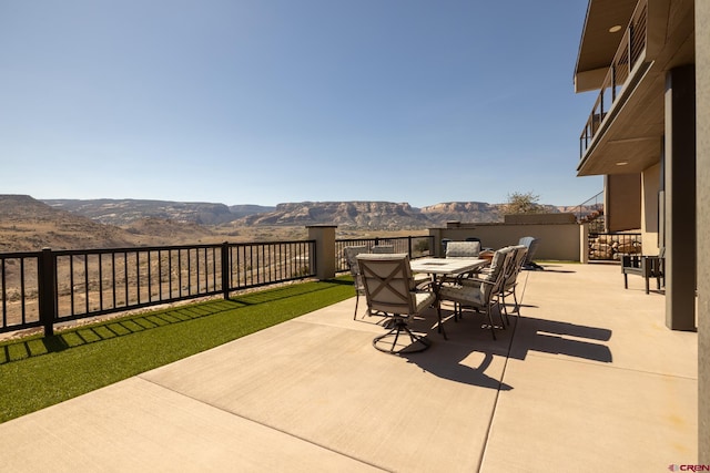 view of patio / terrace with a mountain view