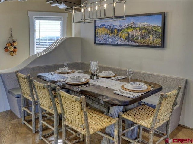 dining area with wood-type flooring