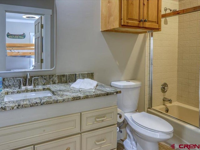 full bathroom featuring vanity, toilet, and enclosed tub / shower combo