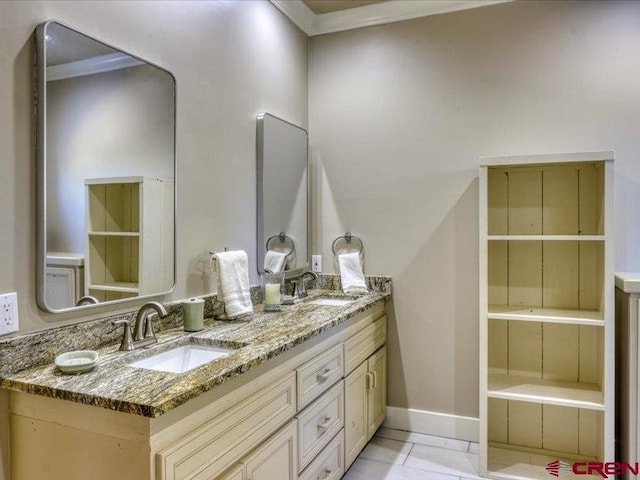 bathroom with ornamental molding, vanity, and tile patterned floors