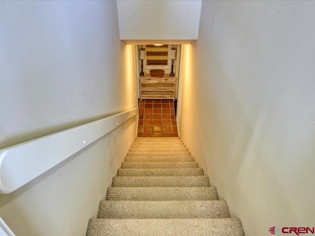 stairway featuring tile patterned floors