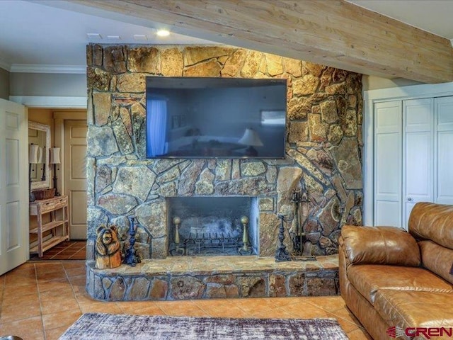 tiled living room featuring a fireplace, vaulted ceiling with beams, and crown molding