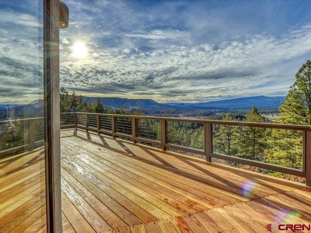 wooden terrace featuring a mountain view