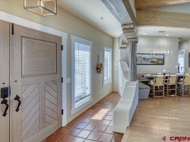 interior space with hardwood / wood-style floors and beamed ceiling