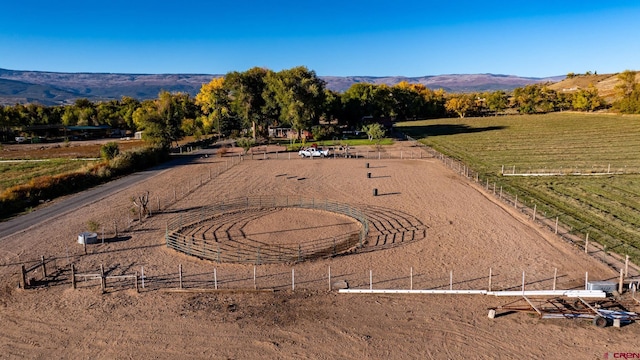 birds eye view of property with a mountain view and a rural view