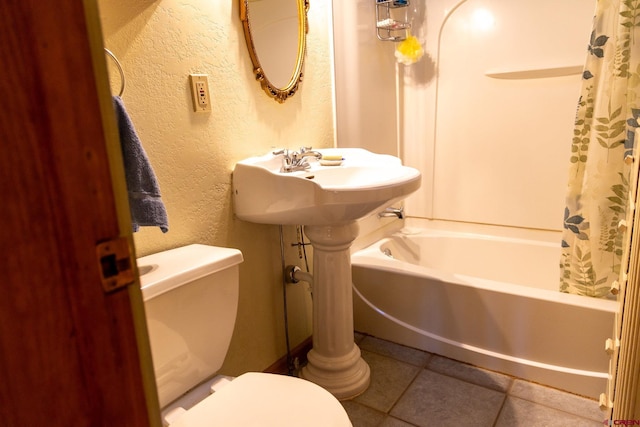 bathroom featuring toilet, tile patterned floors, and shower / bathtub combination with curtain