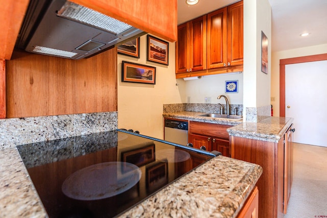 kitchen featuring dishwasher, sink, and light stone counters