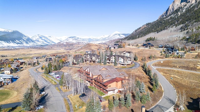 350 Country Club Dr Unit 116A, Crested Butte, CO 81224 - aerial overview of property's location featuring a mountainous background and nearby suburban area