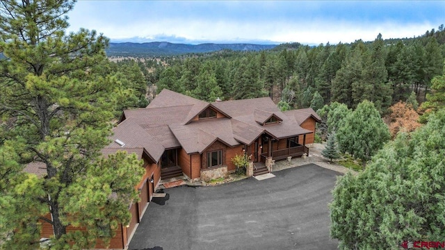 birds eye view of property with a mountain view