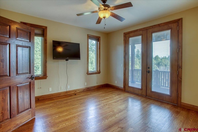 interior space featuring french doors, light hardwood / wood-style flooring, and ceiling fan