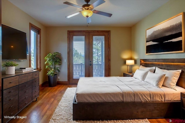 bedroom featuring access to exterior, french doors, light hardwood / wood-style floors, and ceiling fan