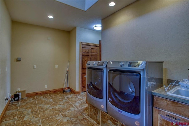 laundry room featuring light tile patterned floors and washer and dryer