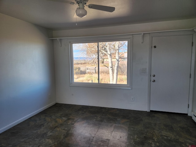 entrance foyer with ceiling fan