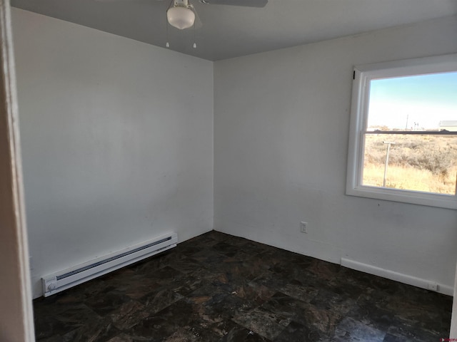 empty room with a baseboard heating unit and ceiling fan