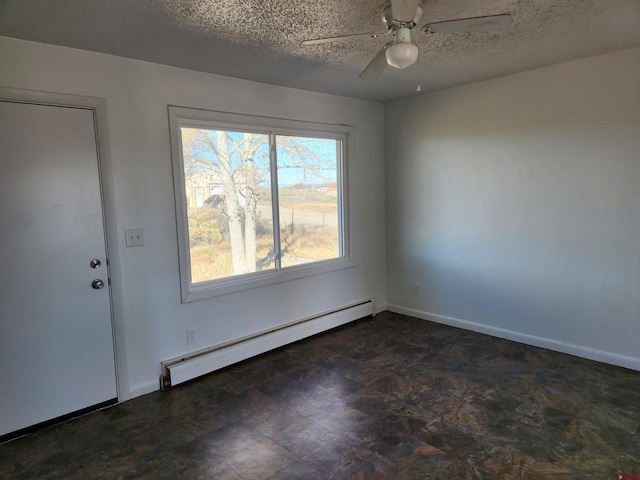 interior space featuring a baseboard heating unit, a textured ceiling, and ceiling fan