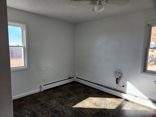 spare room with a textured ceiling and ceiling fan