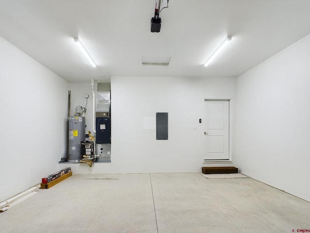 garage featuring electric panel and gas water heater