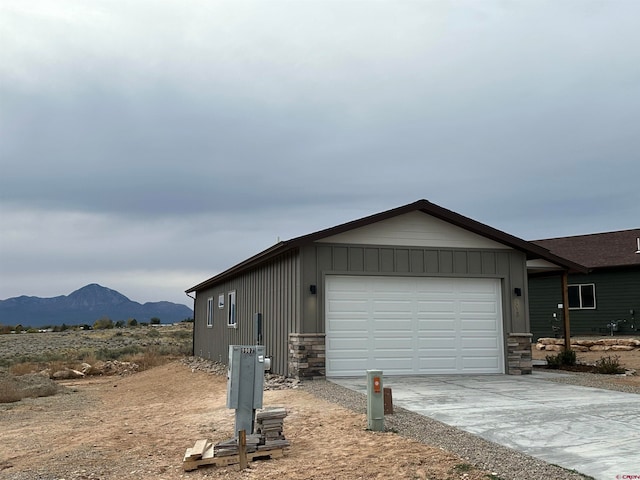 exterior space with a mountain view and a garage