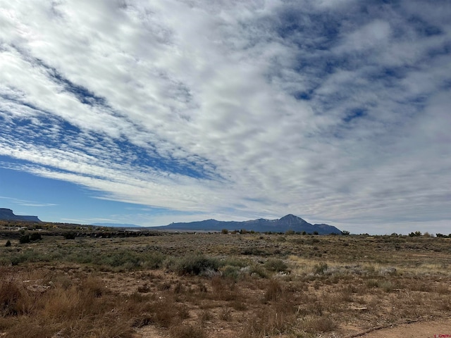 mountain view featuring a rural view