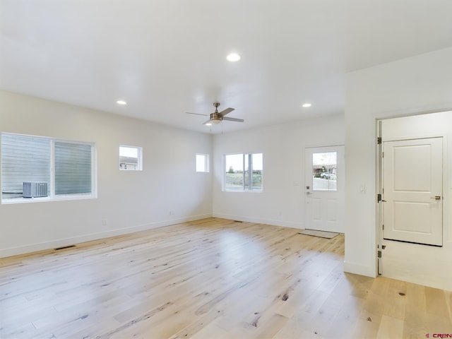 interior space with ceiling fan and light wood-type flooring