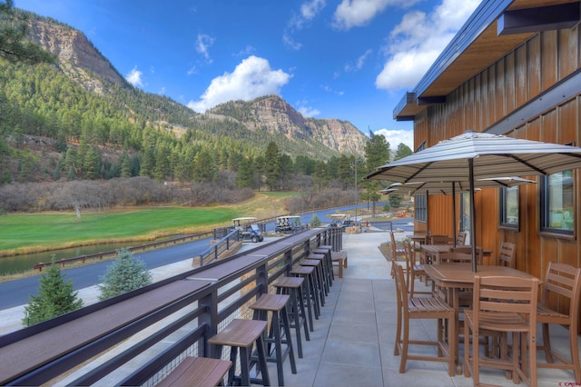 view of patio / terrace featuring a mountain view